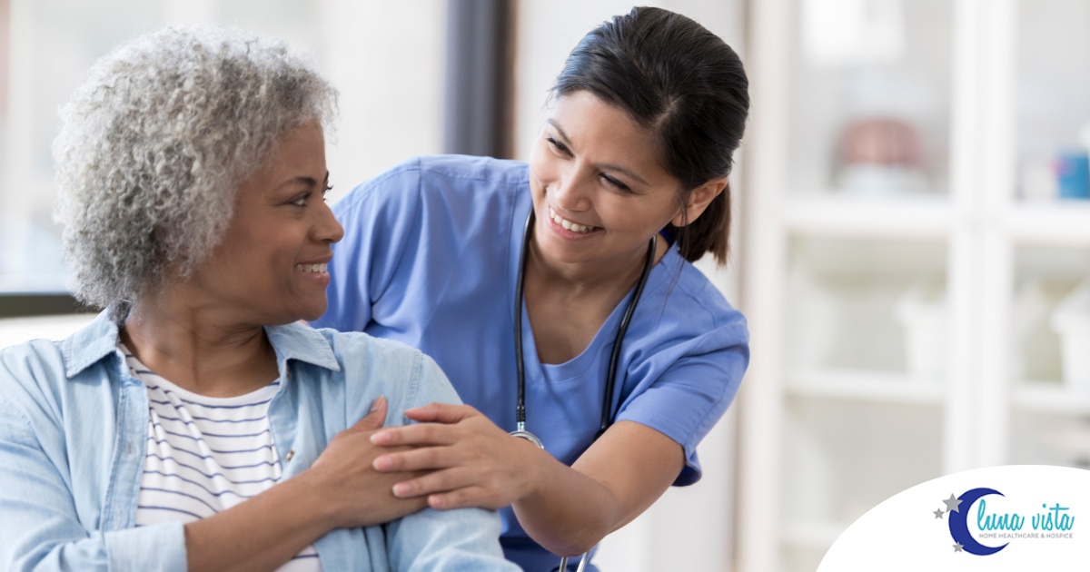 A nurse warmly takes care of a patient, representing the quality care and hard work that National Nurses Month highlights.