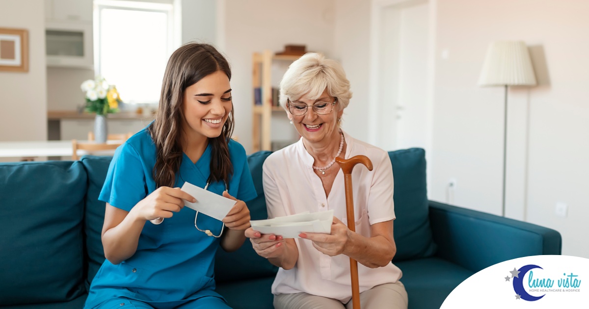 A caregiver reads cards with an older client, representing the fulfillment that comes with a career in home health care.